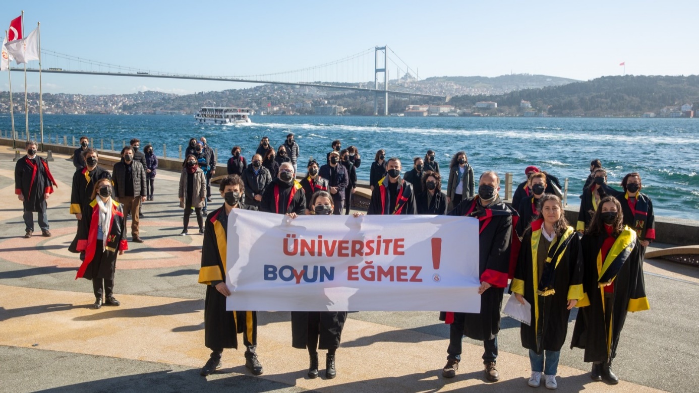 Students of Galatasaray University holding a banner